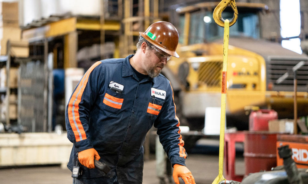 Bulk Team Member Ryan Wearing Hard Hat, Safety Glasses and Gloves