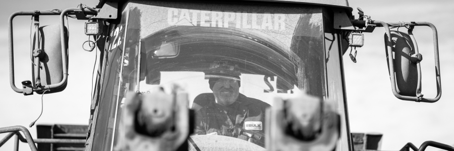 Bulk Team Member Operating CAT Equipment at a Heavy Construction Job Site