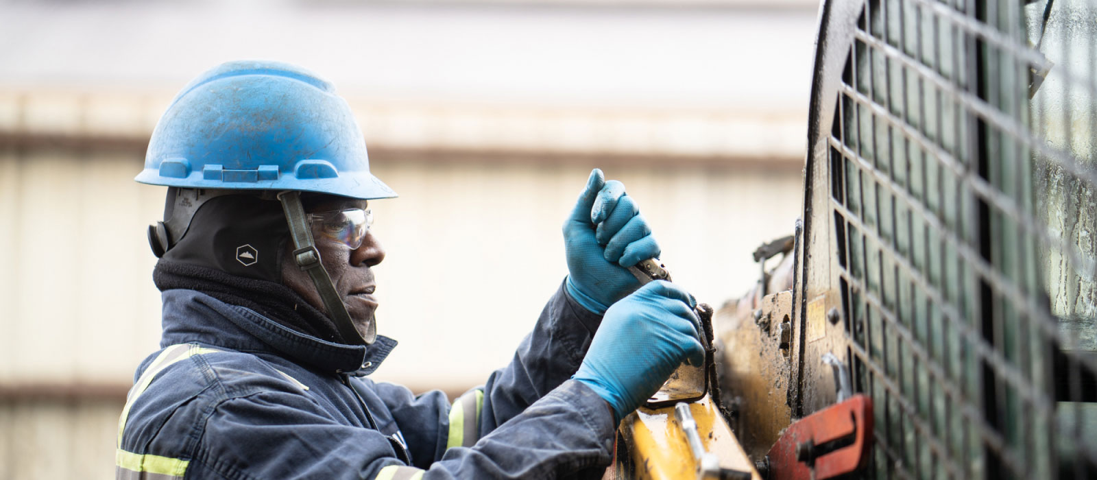 Bulk Team Member in Action Wearing Hard Hat, Safety Glasses & Gloves