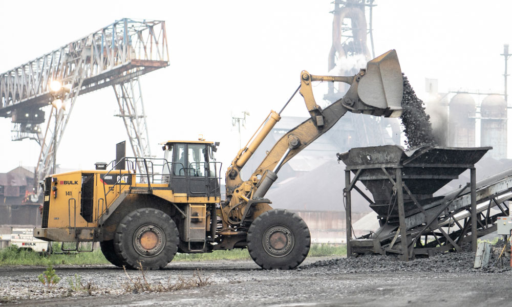 CAT Equipment Unloading Material at Job Site