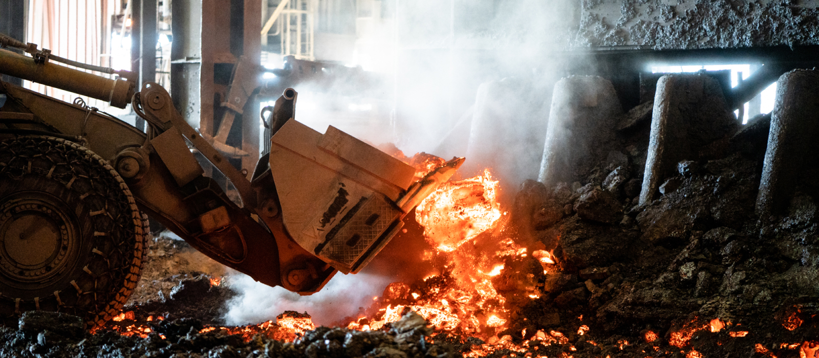 Heavy Equipment Moving Scorching Hot Material at Steel Mill