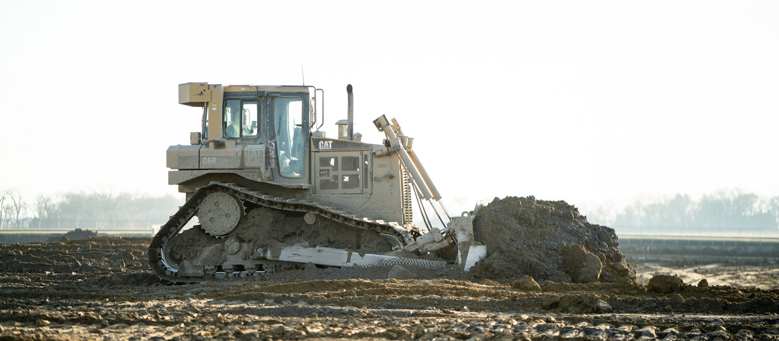 CAT D6B Dozer Equipment Moving Dirt at Job Site
