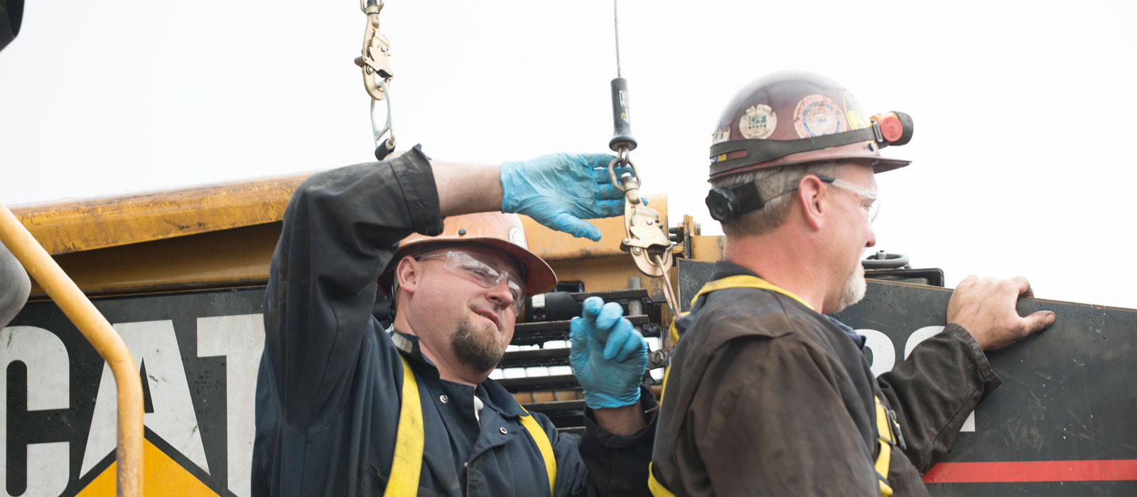 Two Bulk Team Members Working on Specialty Equipment