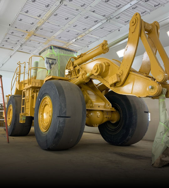 Yellow Heavy Equipment In The Process of Being Rebuilt by Bulk's Team