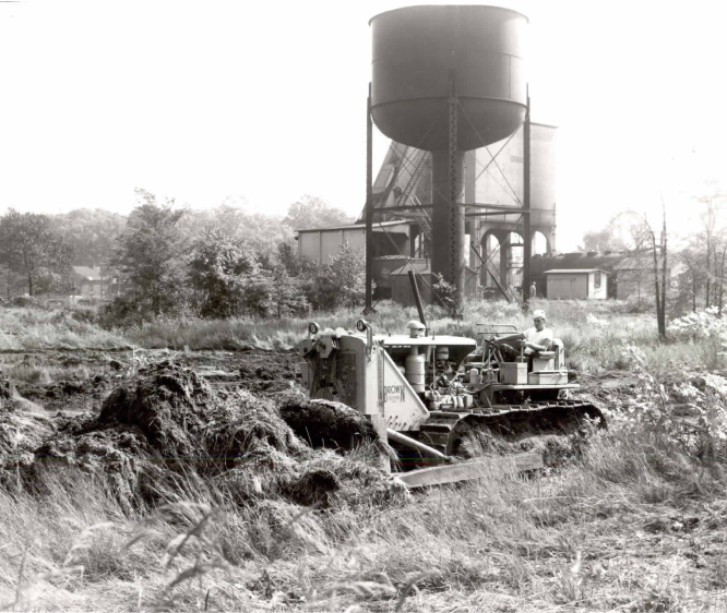 One Of Brown's Employees Operating Heavy Equipment At A Job Site Back In The Day