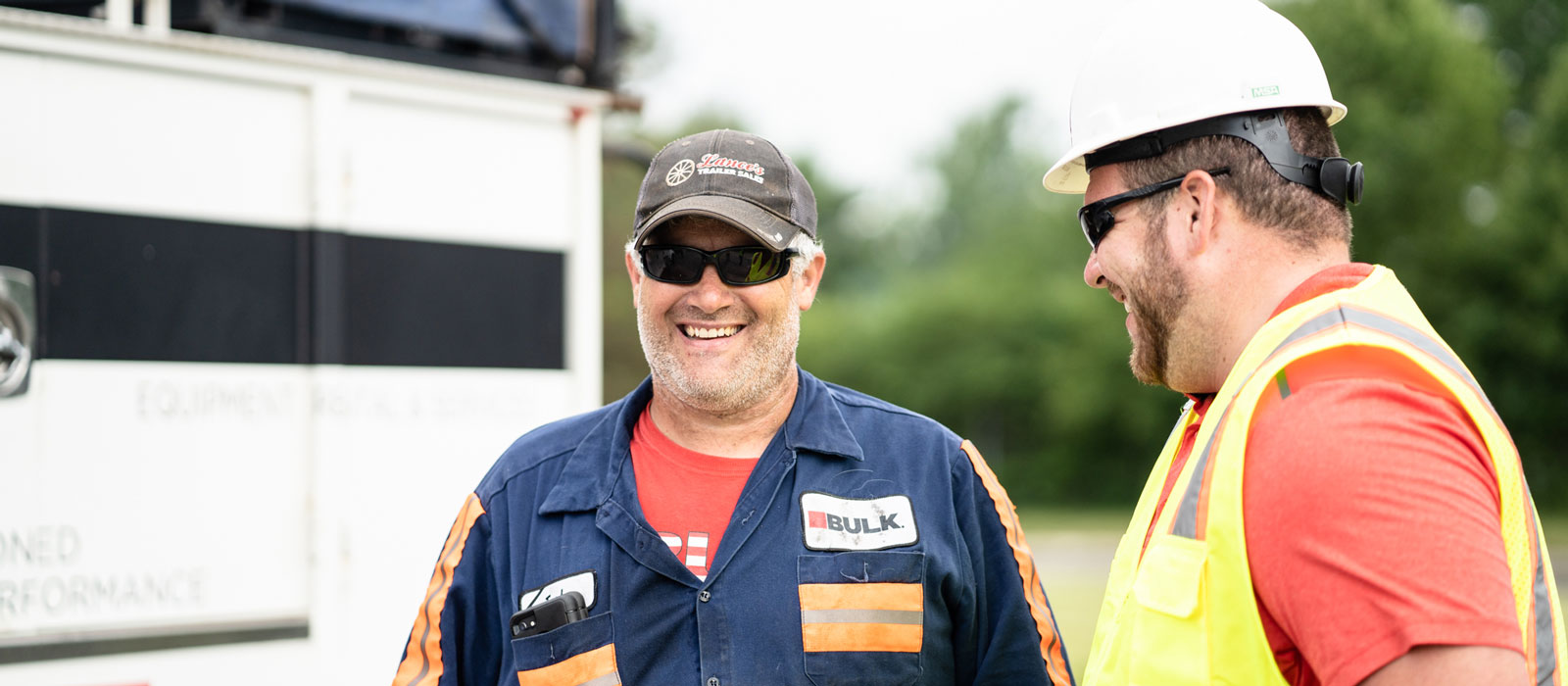 Two Bulk Employees Smiling