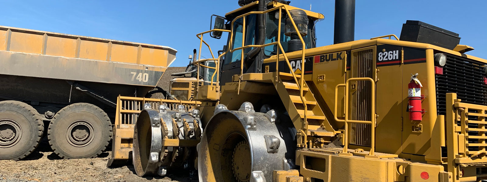 Cat® 826h And Dump Truck At Project Site