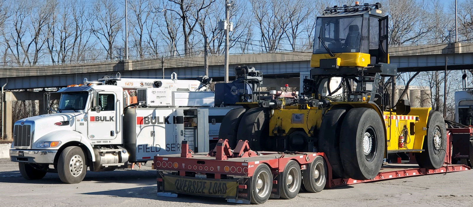 Side Loader Rolling Up Onsite To Be Assembled