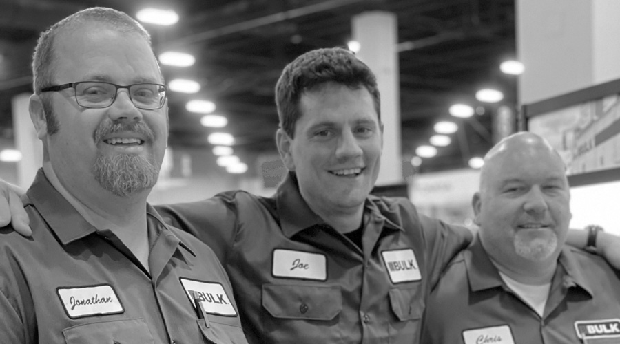 Three Bulk Equipment employees smiling at the camera
